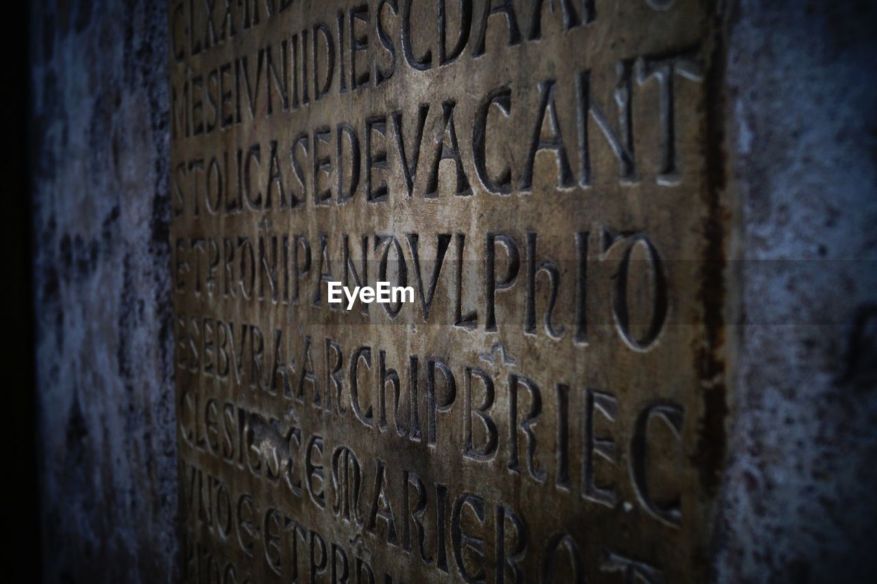 CLOSE-UP OF TEXT ON WALL