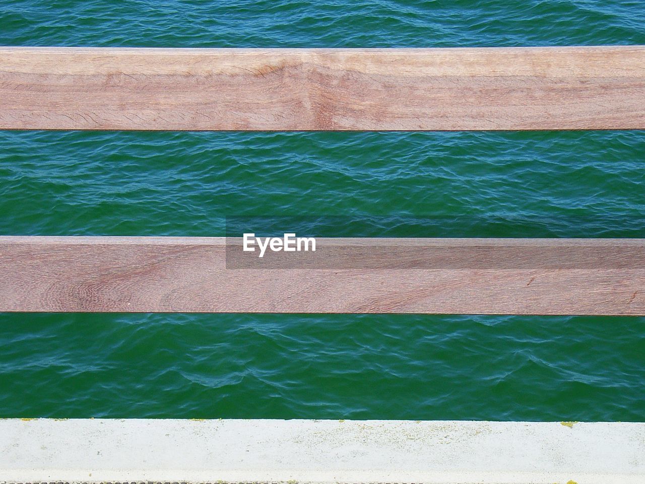 Full frame shot of weathred planks against sea
