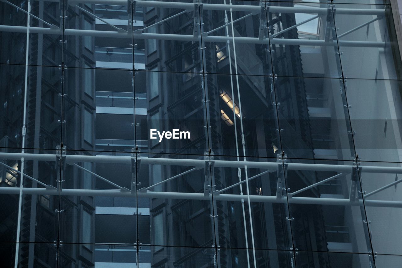 Elevator seen through glass building