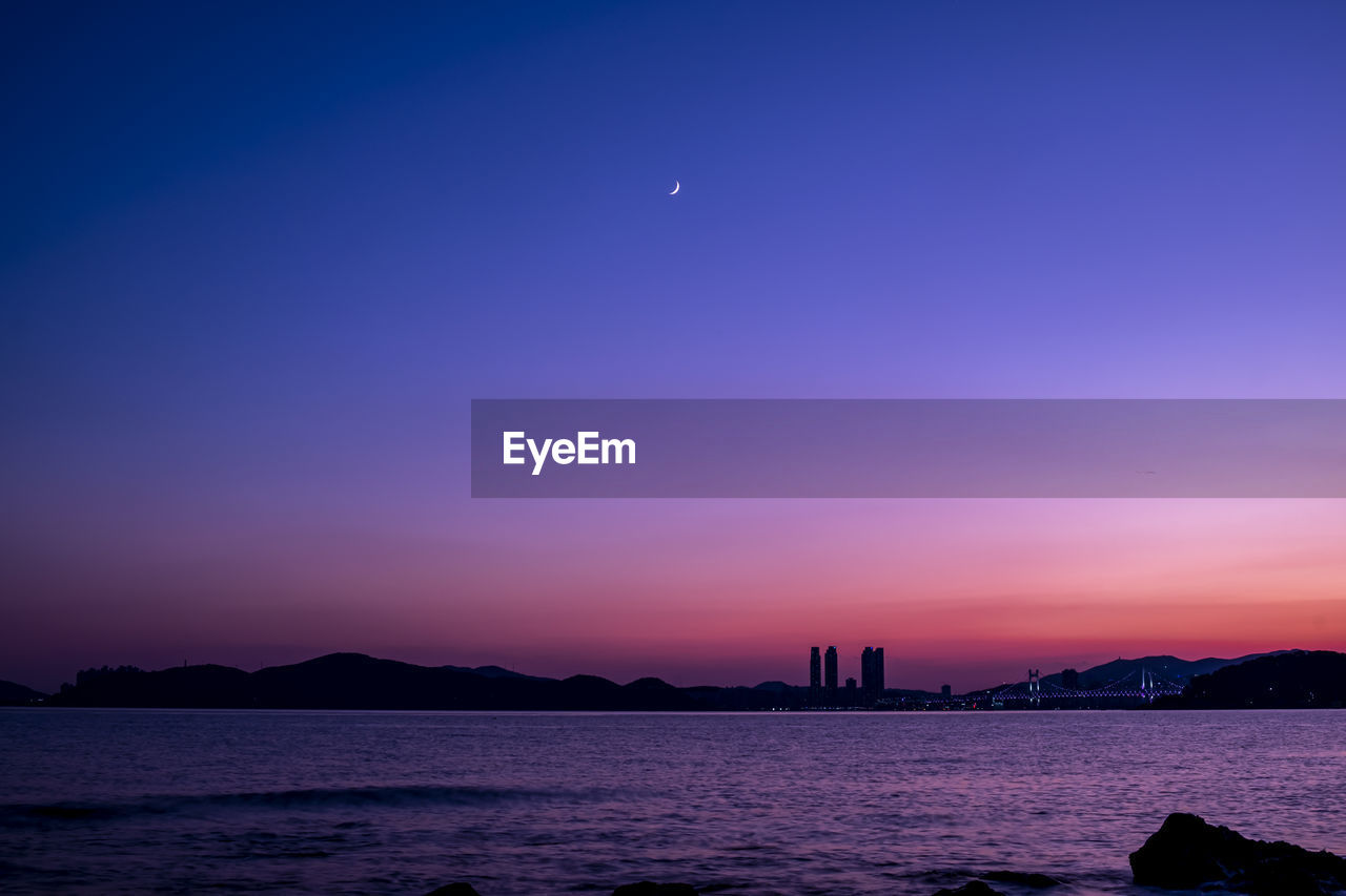 Scenic view of sea against the sky at sunset