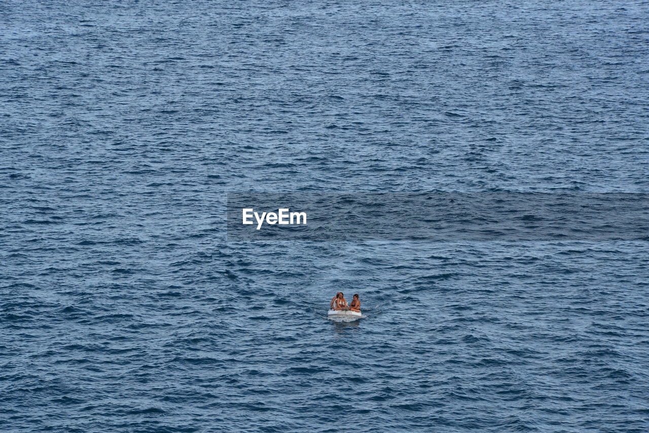 High angle view of people on boat in sea