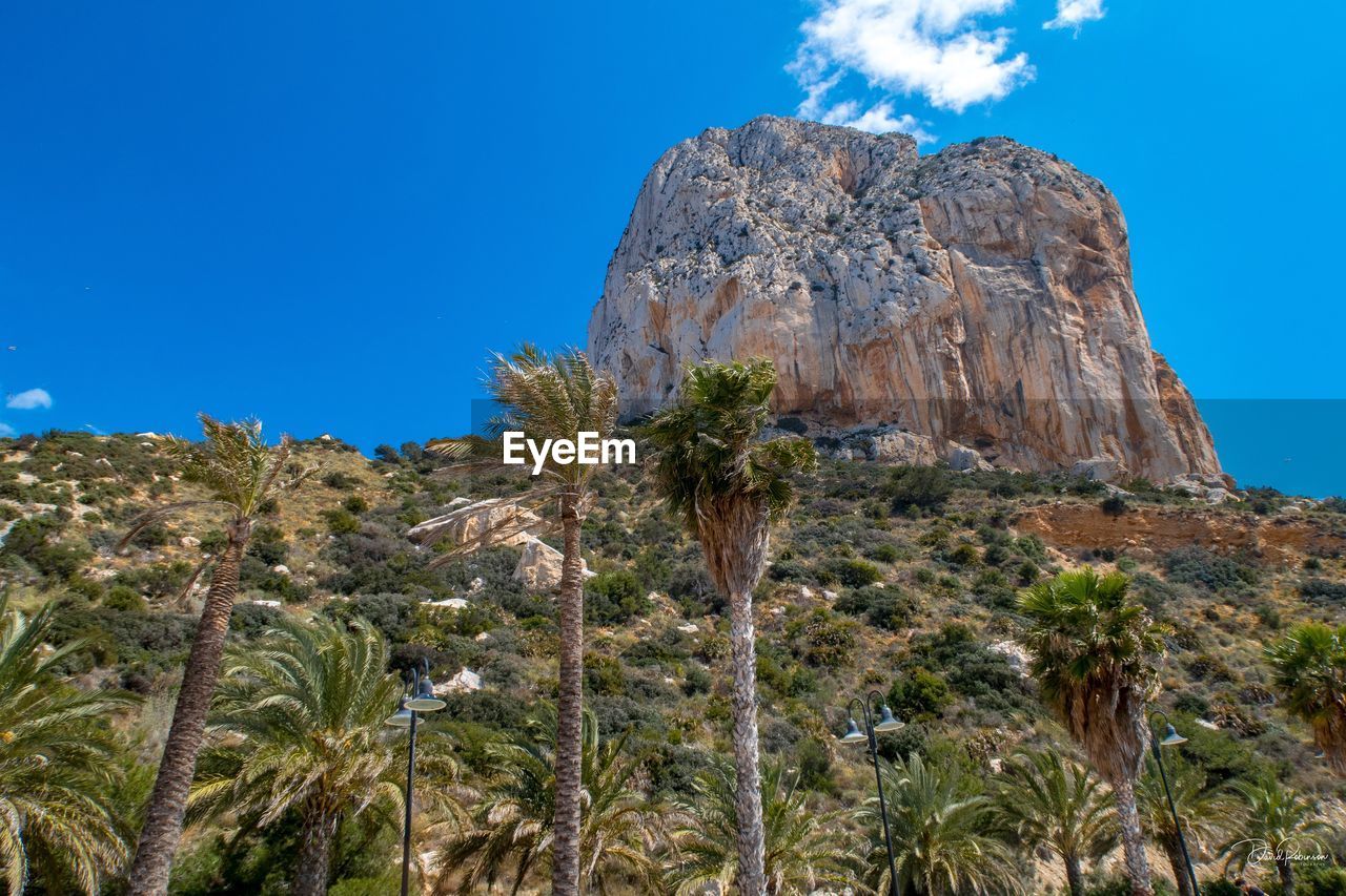 Low angle view of rock formation against sky