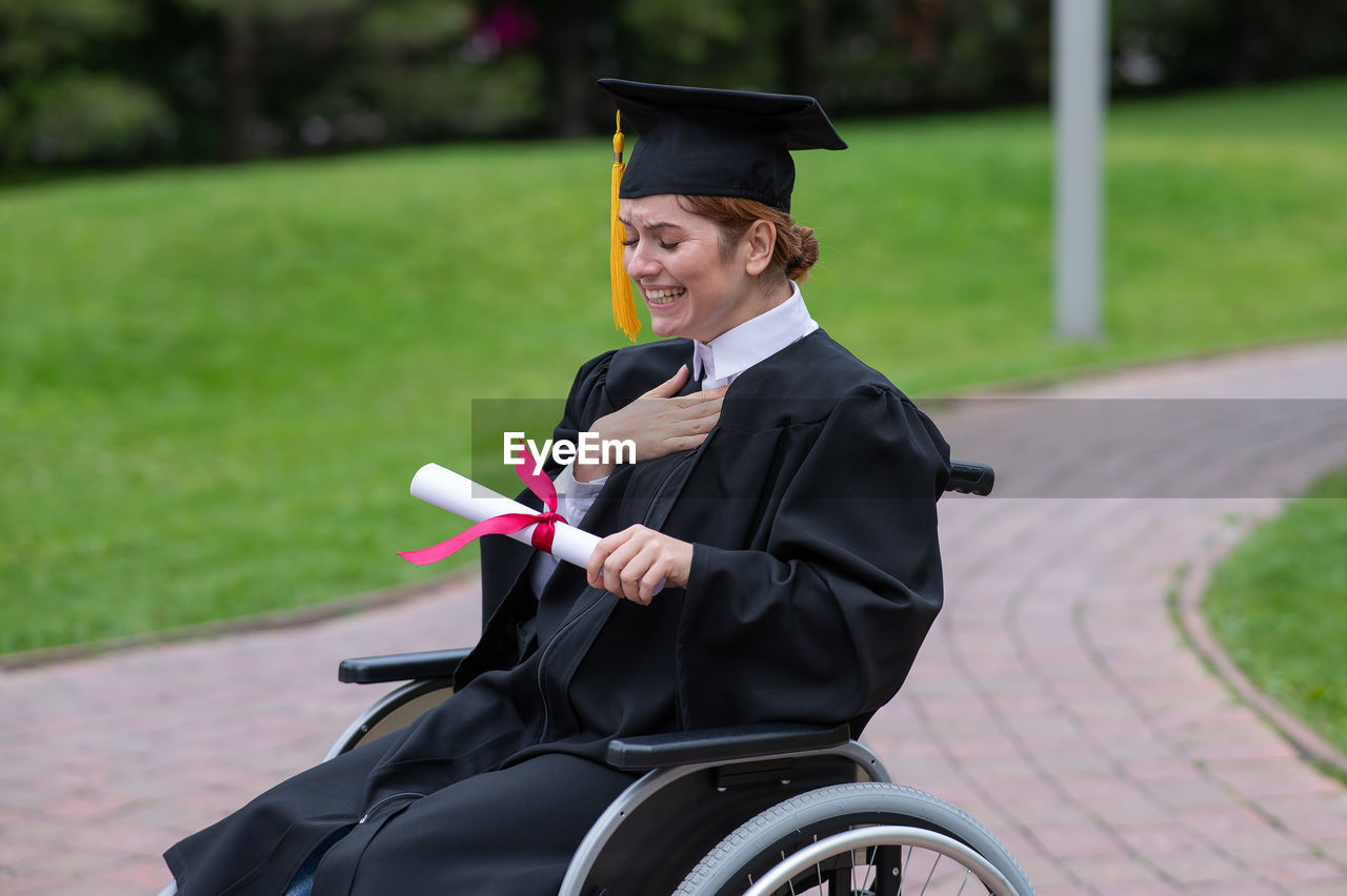 rear view of man wearing graduation gown