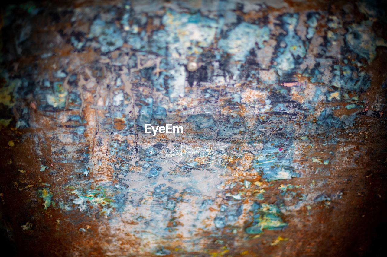 close-up, no people, blue, rusty, reflection, multi colored, vignette, backgrounds, indoors, macro photography, metal, textured, full frame, abstract