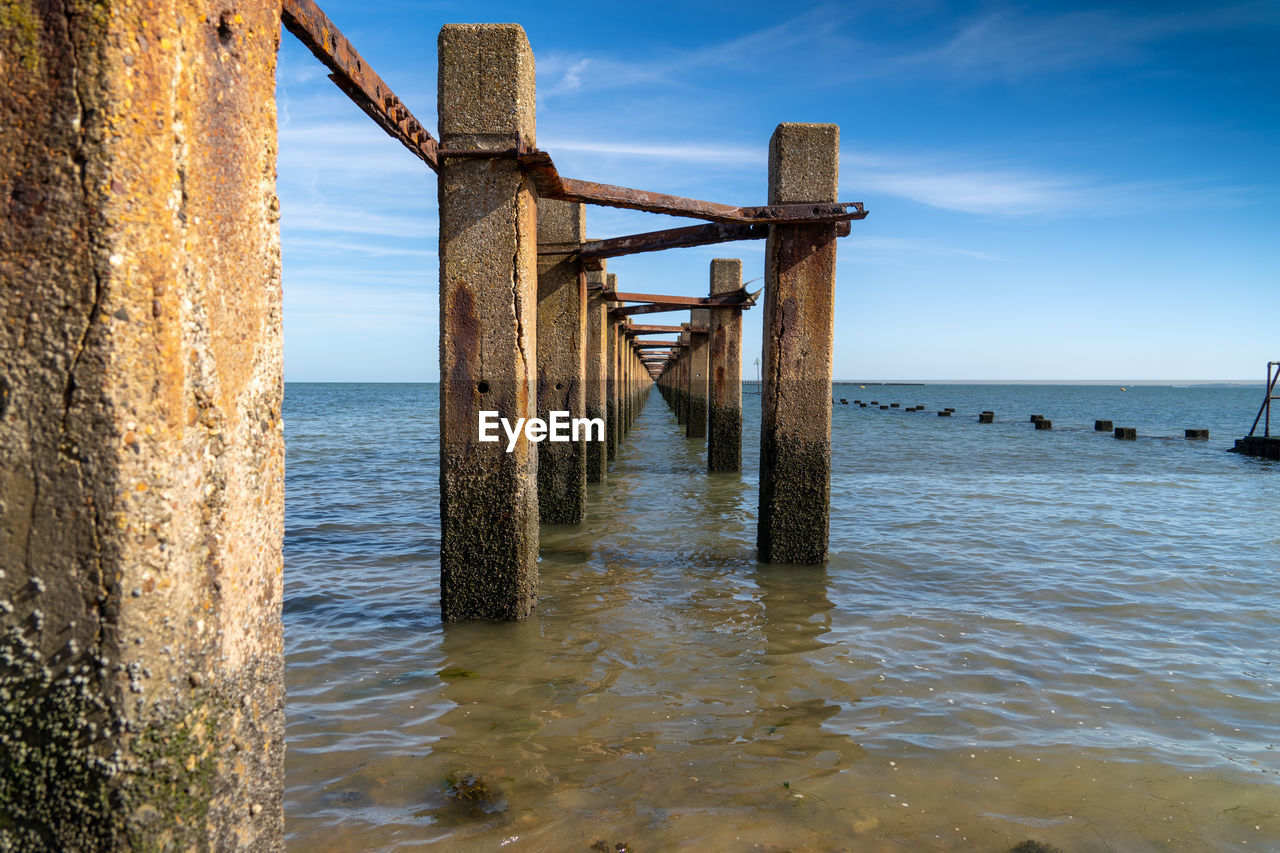 Pier over sea against sky