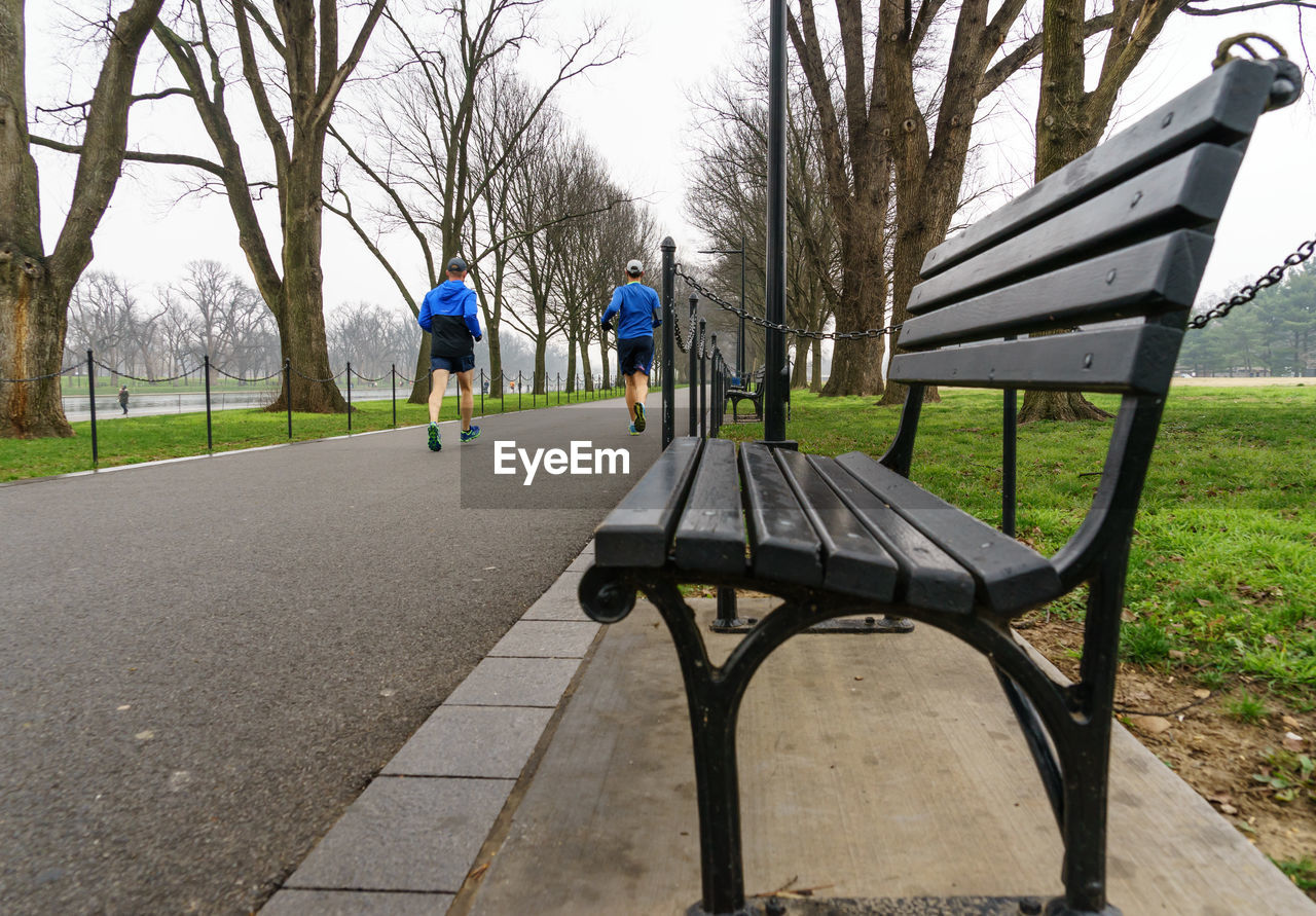 Close-up of bench by street