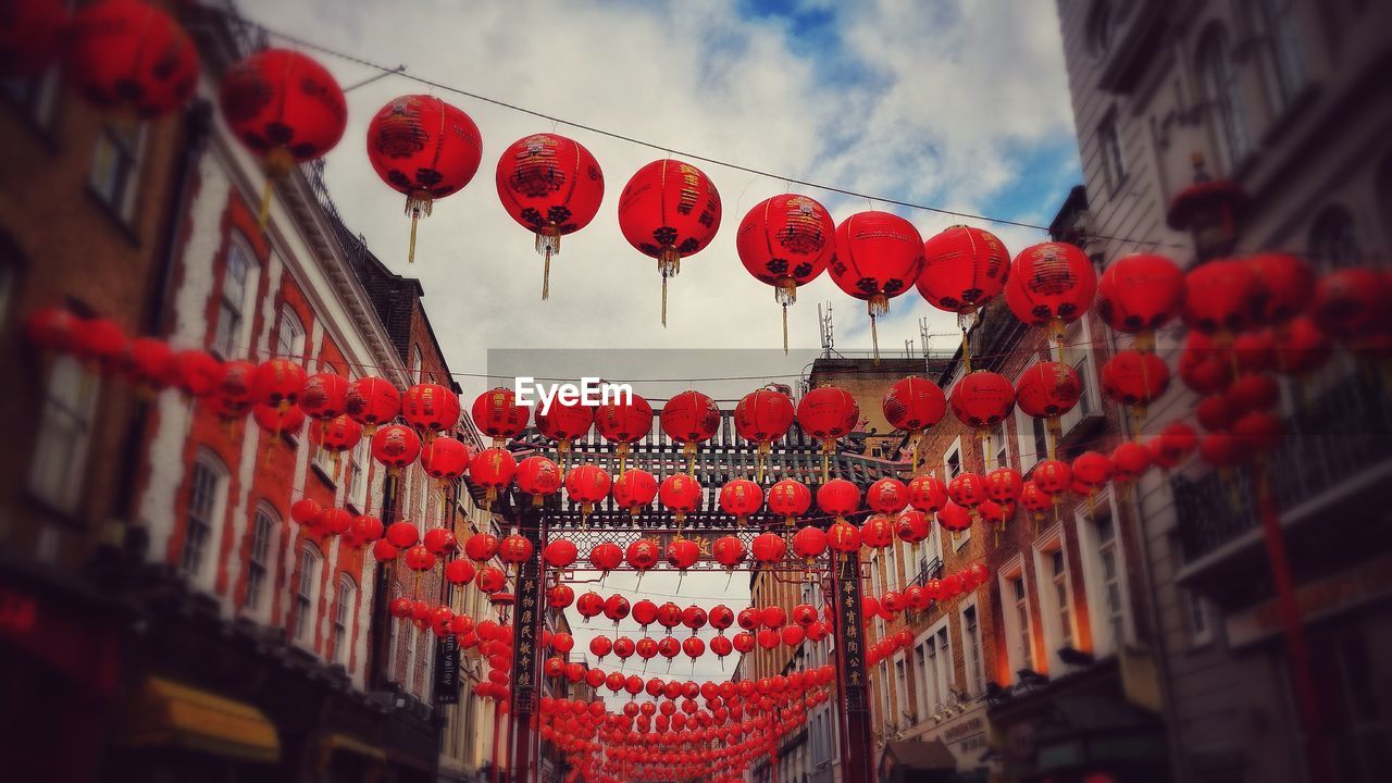 LANTERNS HANGING AGAINST SKY