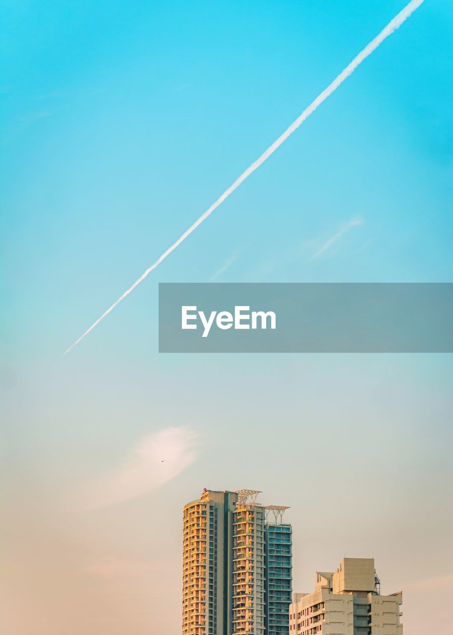 Low angle view of buildings against blue sky