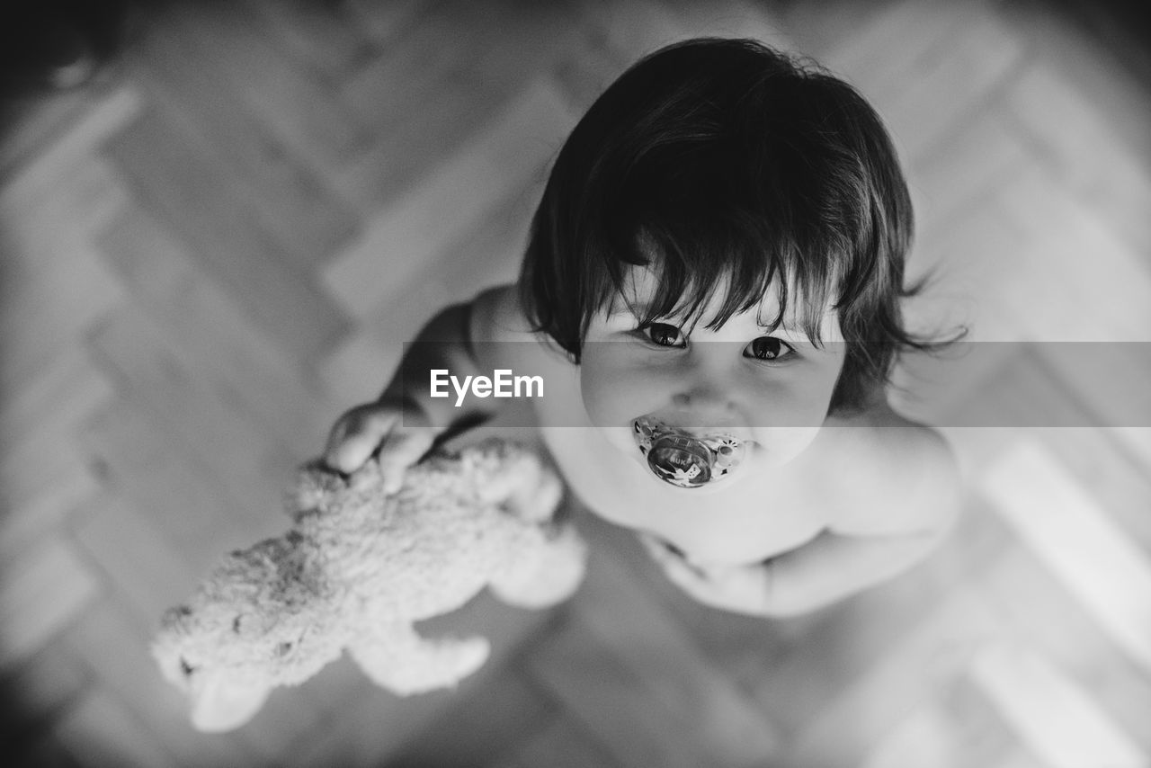 CLOSE-UP OF BOY HOLDING ICE CREAM