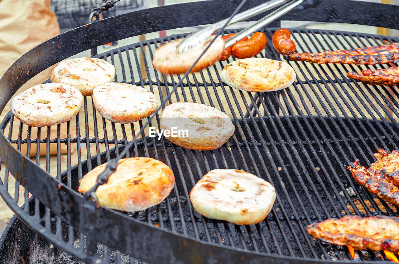 food, food and drink, barbecue grill, barbecue, fast food, freshness, grilled, grilling, dish, heat, high angle view, no people, grid, day, metal grate, grate, metal, meat, cooking, cuisine, baked, close-up, outdoors, produce, healthy eating, wellbeing, preparing food, still life