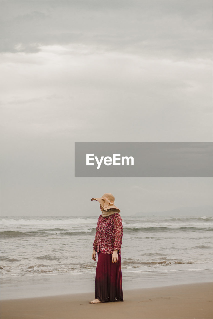 A woman is enjoying a vacation on a beach in indonesia