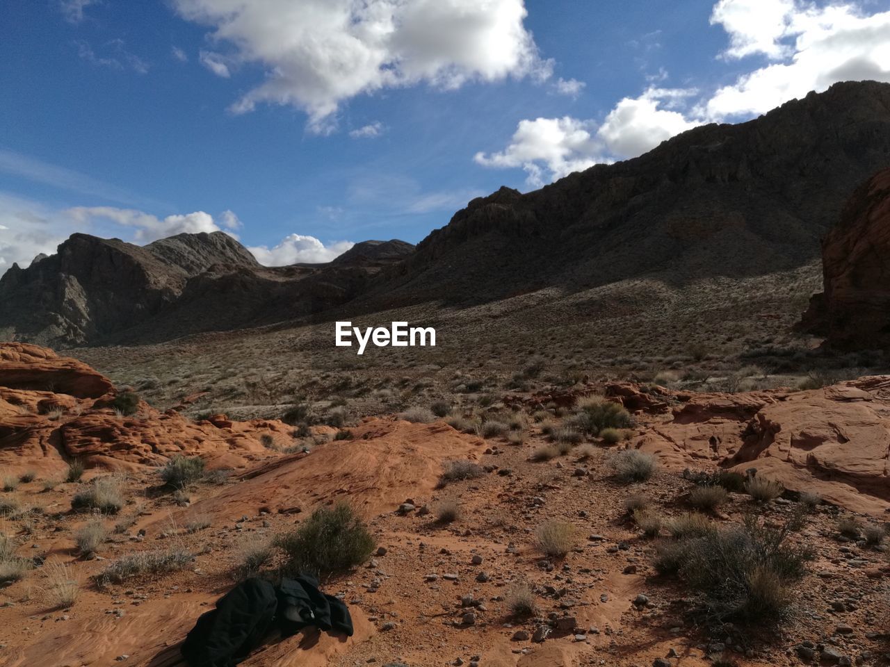 Scenic view of mountains against cloudy sky