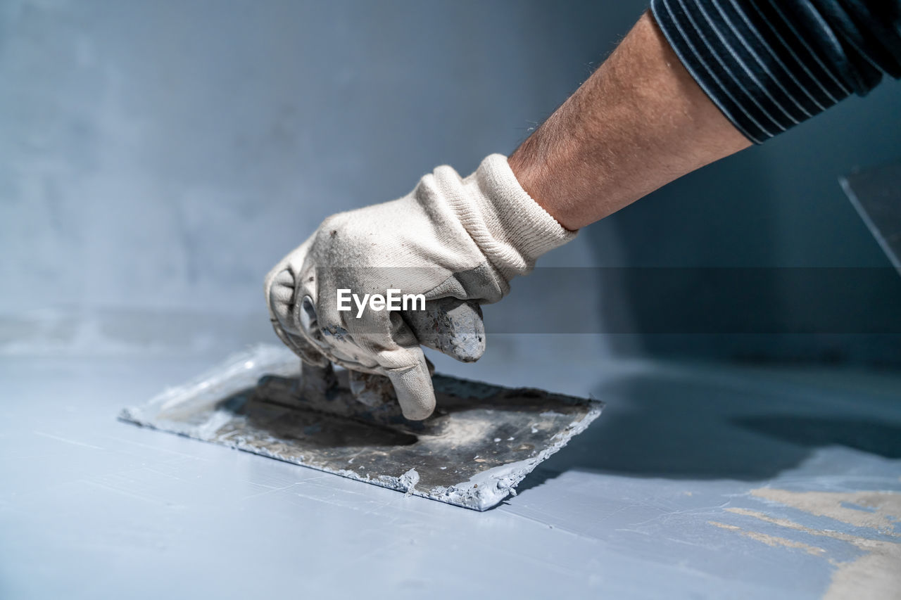 cropped image of man working on wood