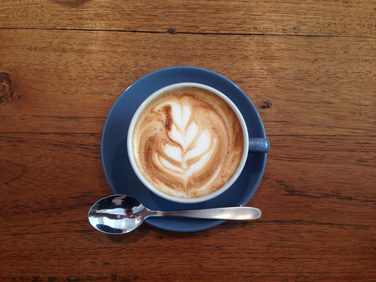 DIRECTLY ABOVE SHOT OF COFFEE CUP WITH COFFEE CUP