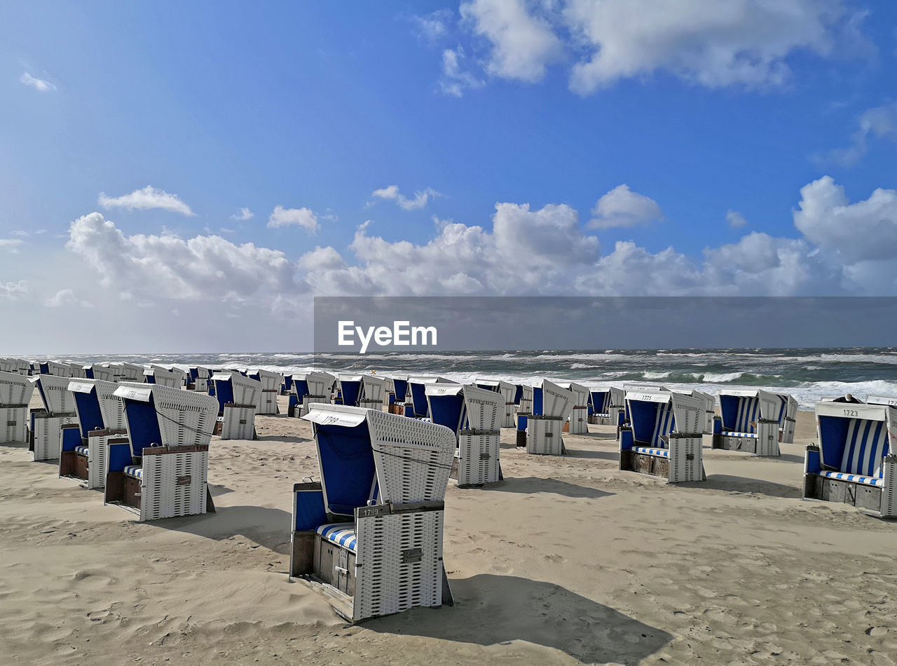 Beach in westerland / sylt with beach chairs and blue sky