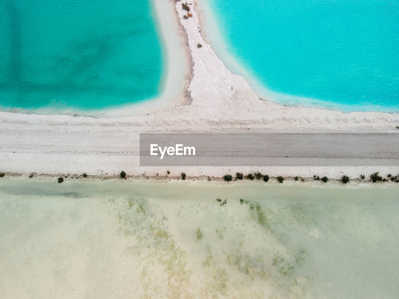 HIGH ANGLE VIEW OF SWIMMING POOL IN SEA