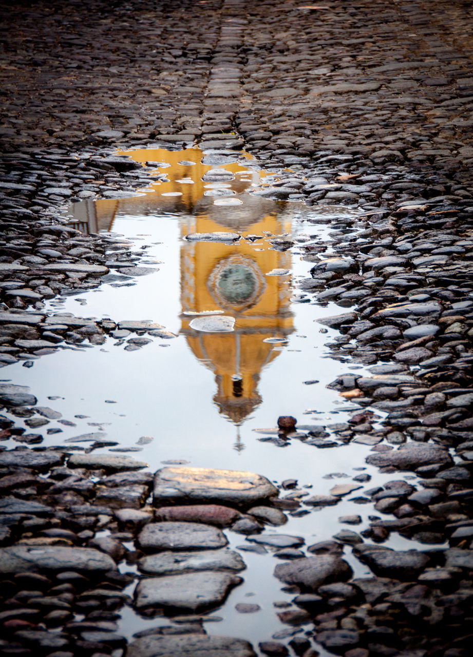 High angle view of church reflecting on puddle