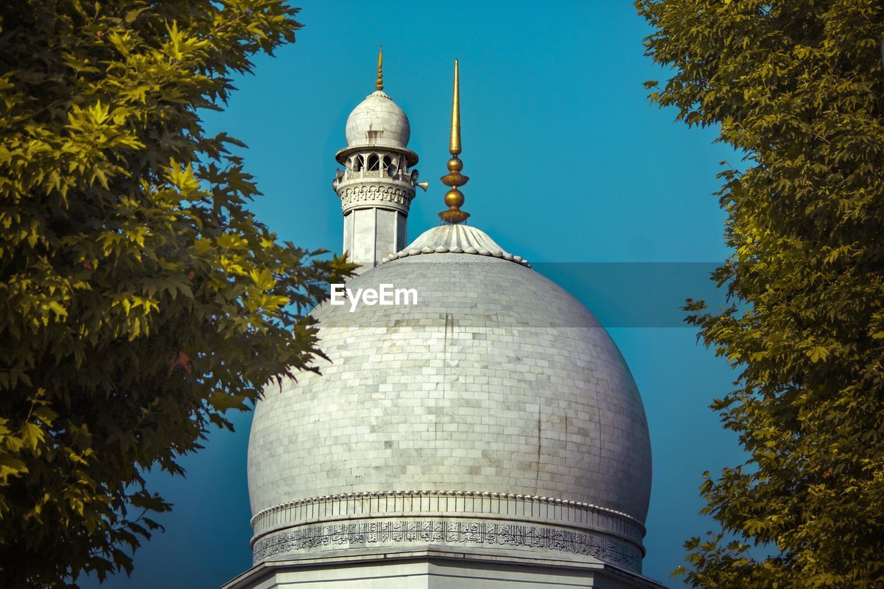 Low angle view of mosque against sky