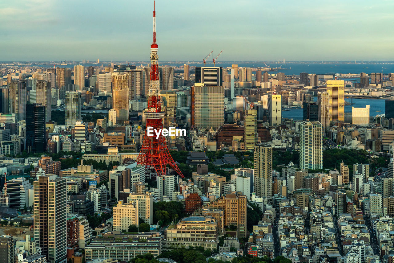 Aerial view of tower and buildings in city