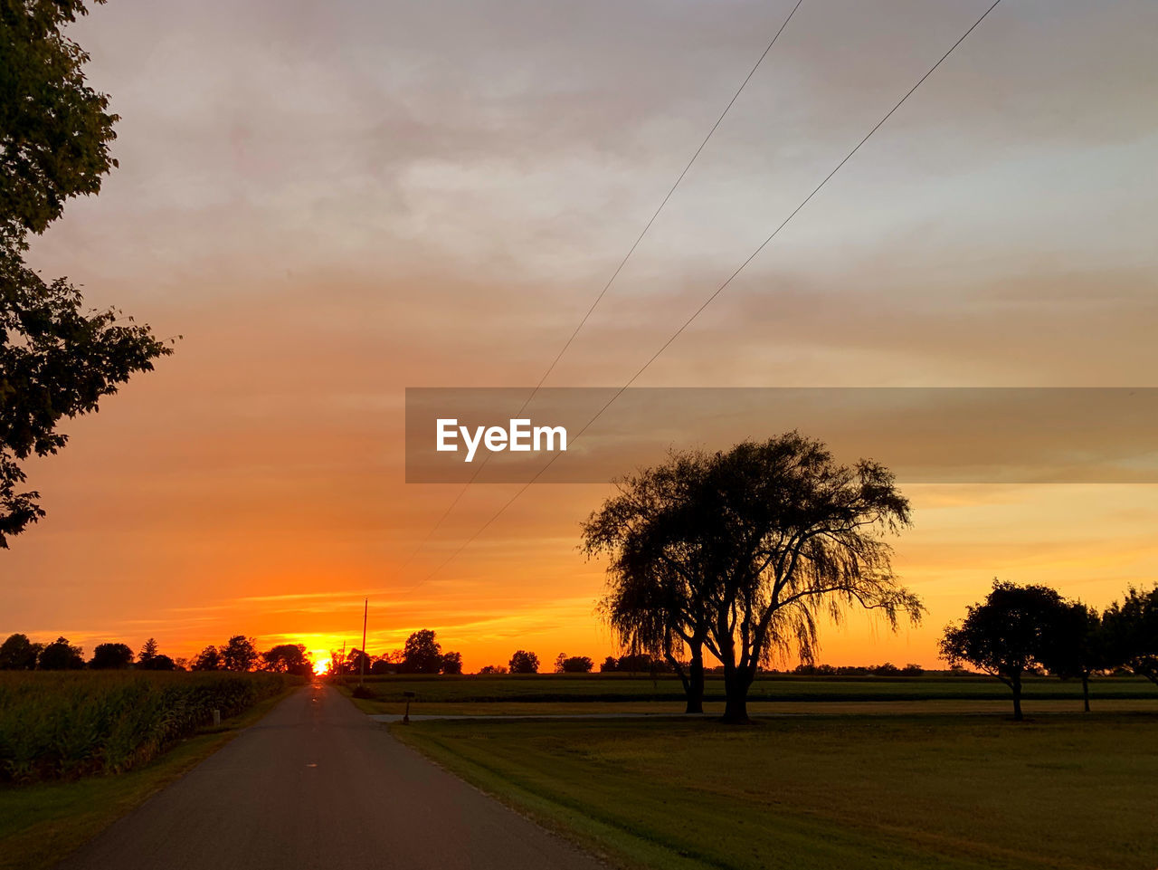 SCENIC VIEW OF ROAD AGAINST SKY DURING SUNSET