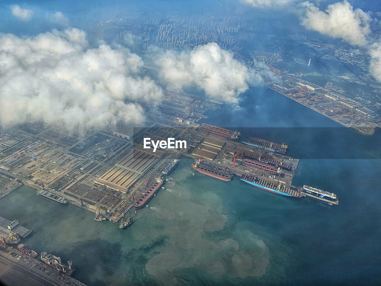 water, aerial view, aerial photography, transportation, industry, business, architecture, sea, nautical vessel, nature, freight transportation, cloud, environment, business finance and industry, sky, ship, no people, outdoors, shipping, built structure, mode of transportation, vehicle, harbor, high angle view