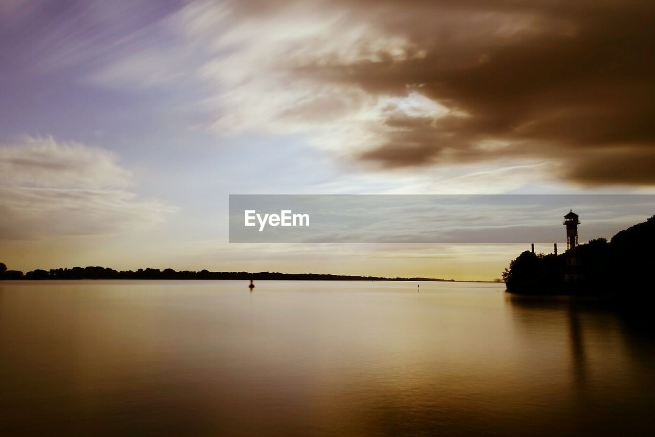 SCENIC VIEW OF SUNSET OVER WATER