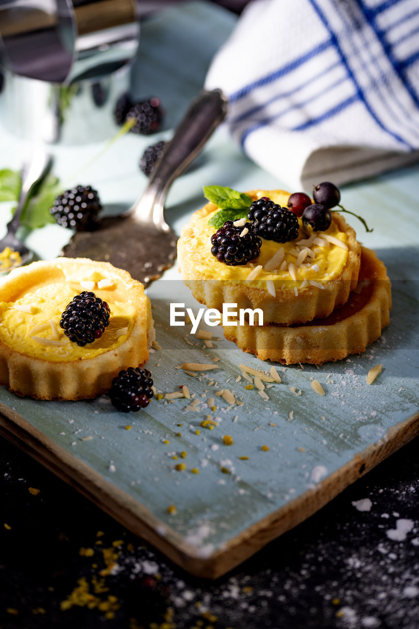 Delicious freshly prepared tartlets with berries and mint leaves