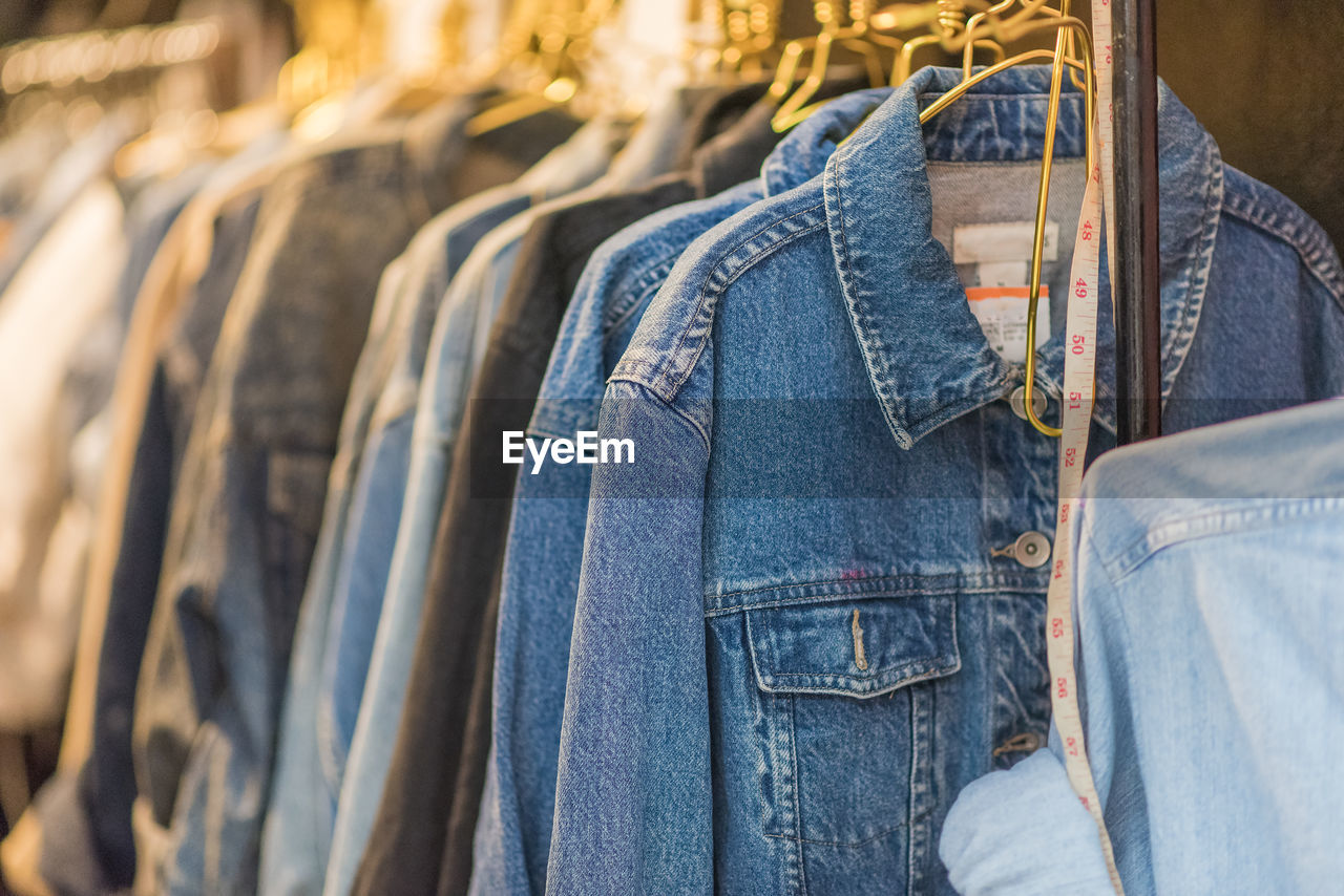 Clothes hanging on rack in store