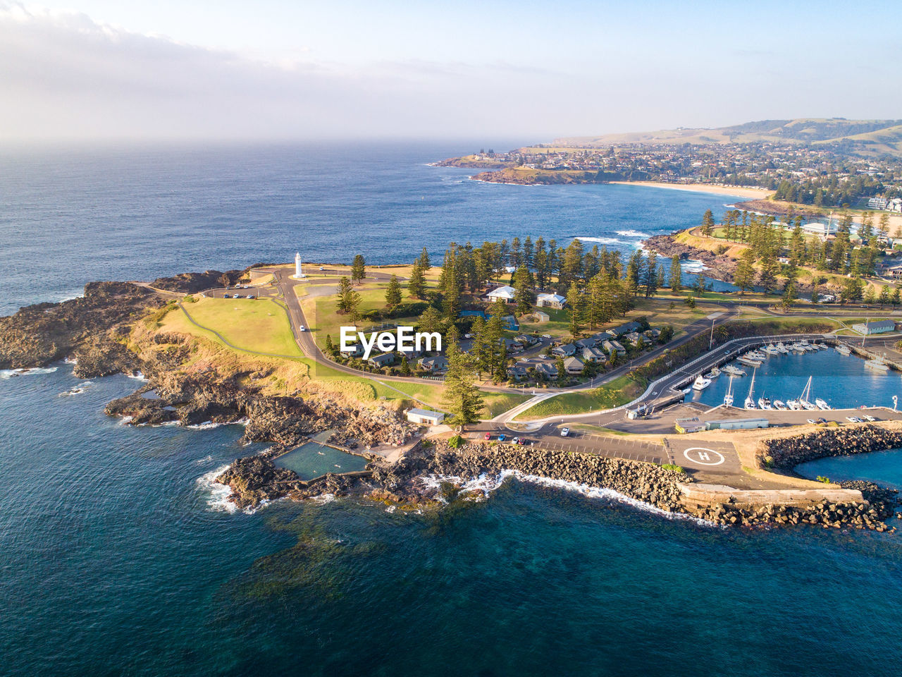 HIGH ANGLE VIEW OF CITY BY SEA AND BUILDINGS