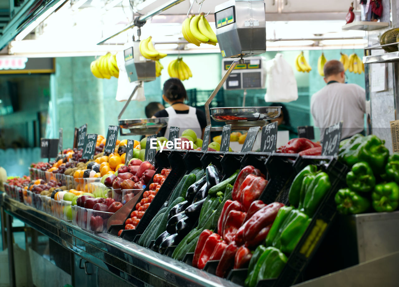 Vegetables and fruits for sale at market stall