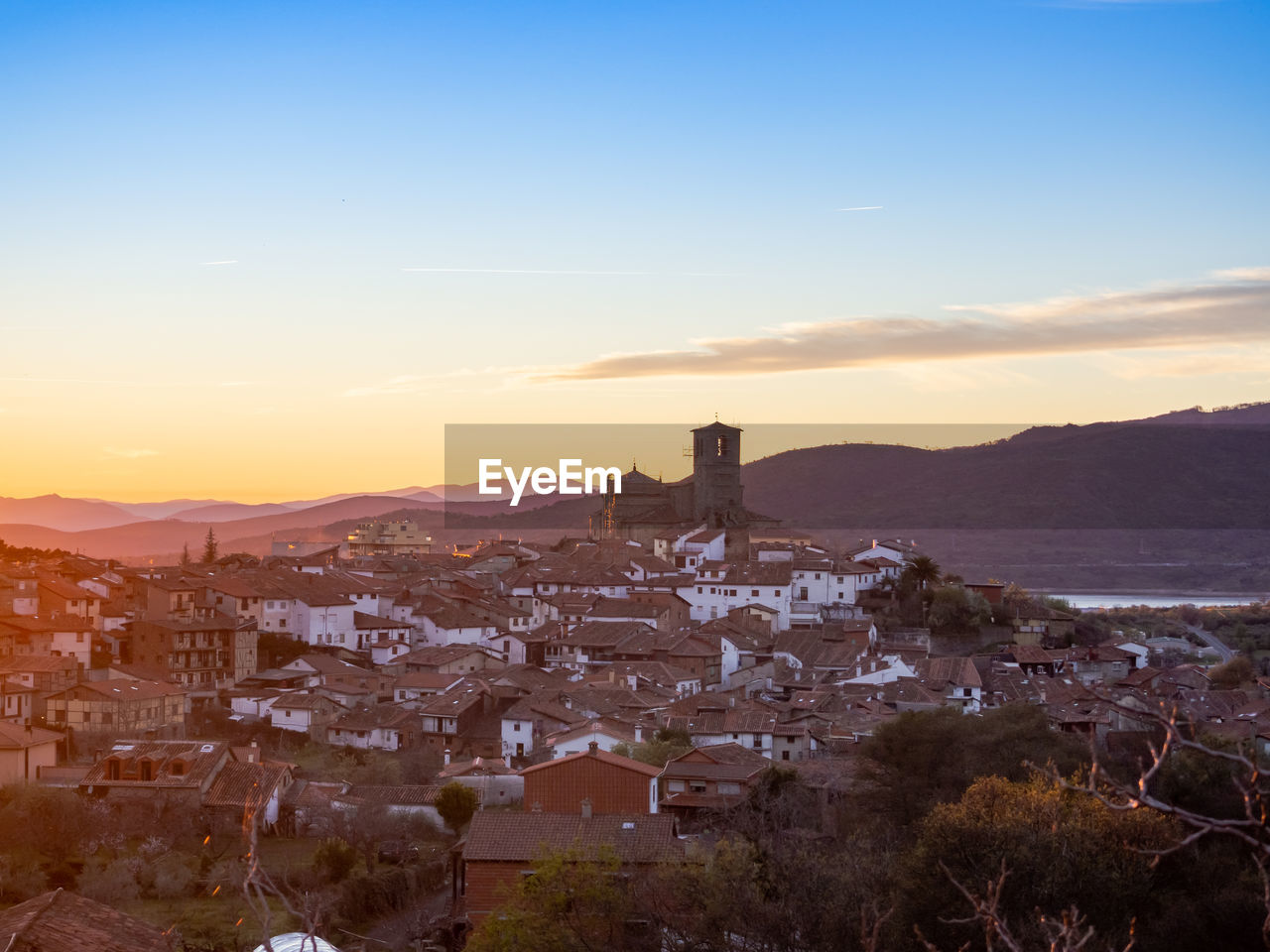 High angle view of townscape against sky at sunset