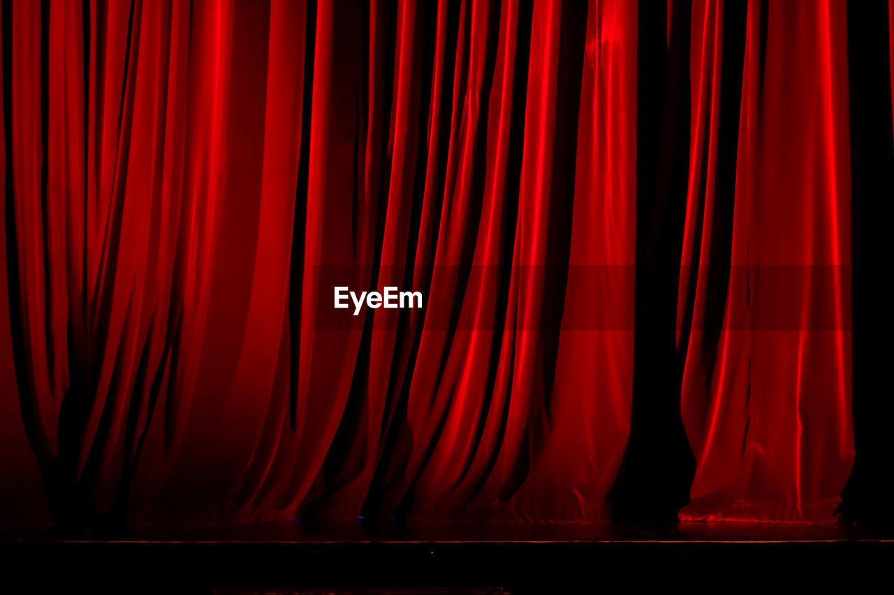 Red curtain on empty stage