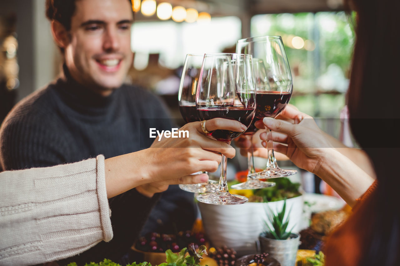 Friends toasting wineglasses in restaurant