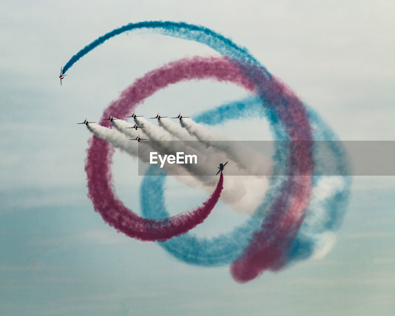 Low angle view of airshow against sky