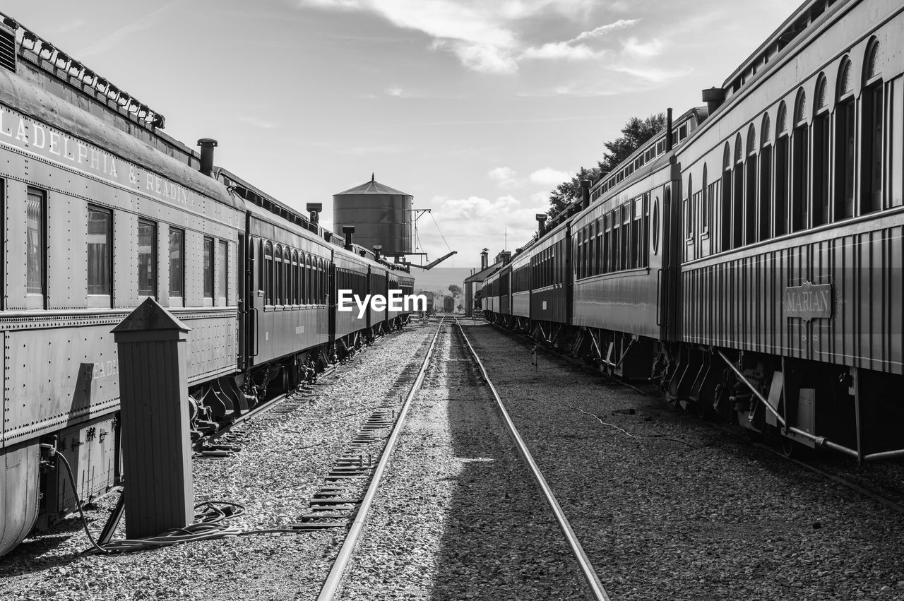 Train on railroad tracks against sky