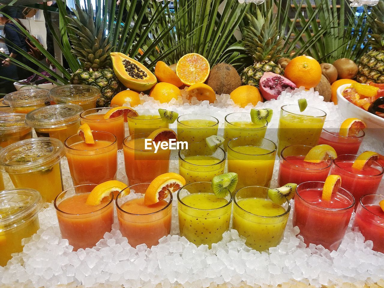 Various fruits on glass with ice cream