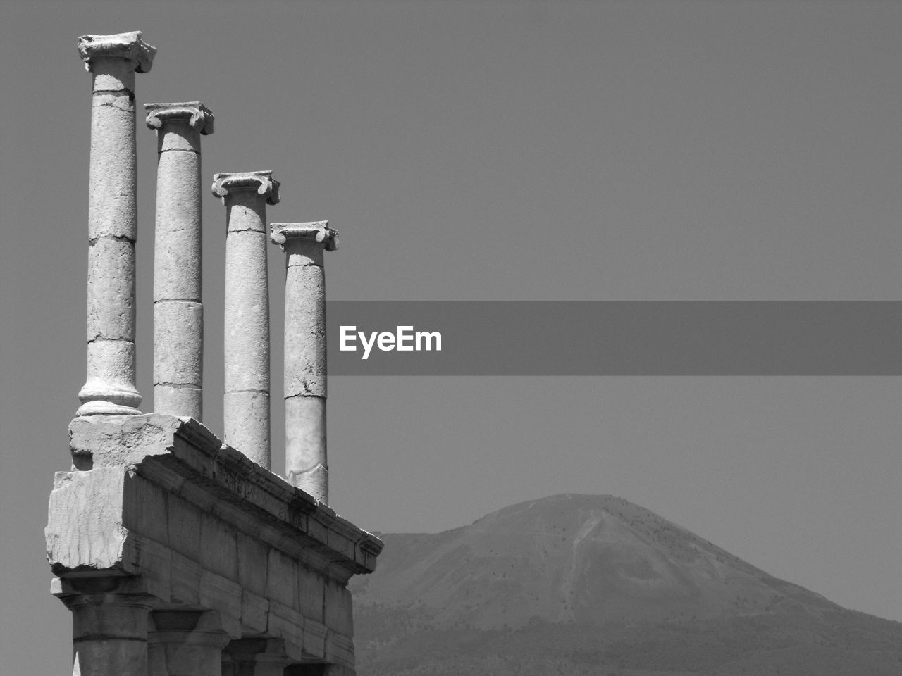 Historic columns against sky at pompeii