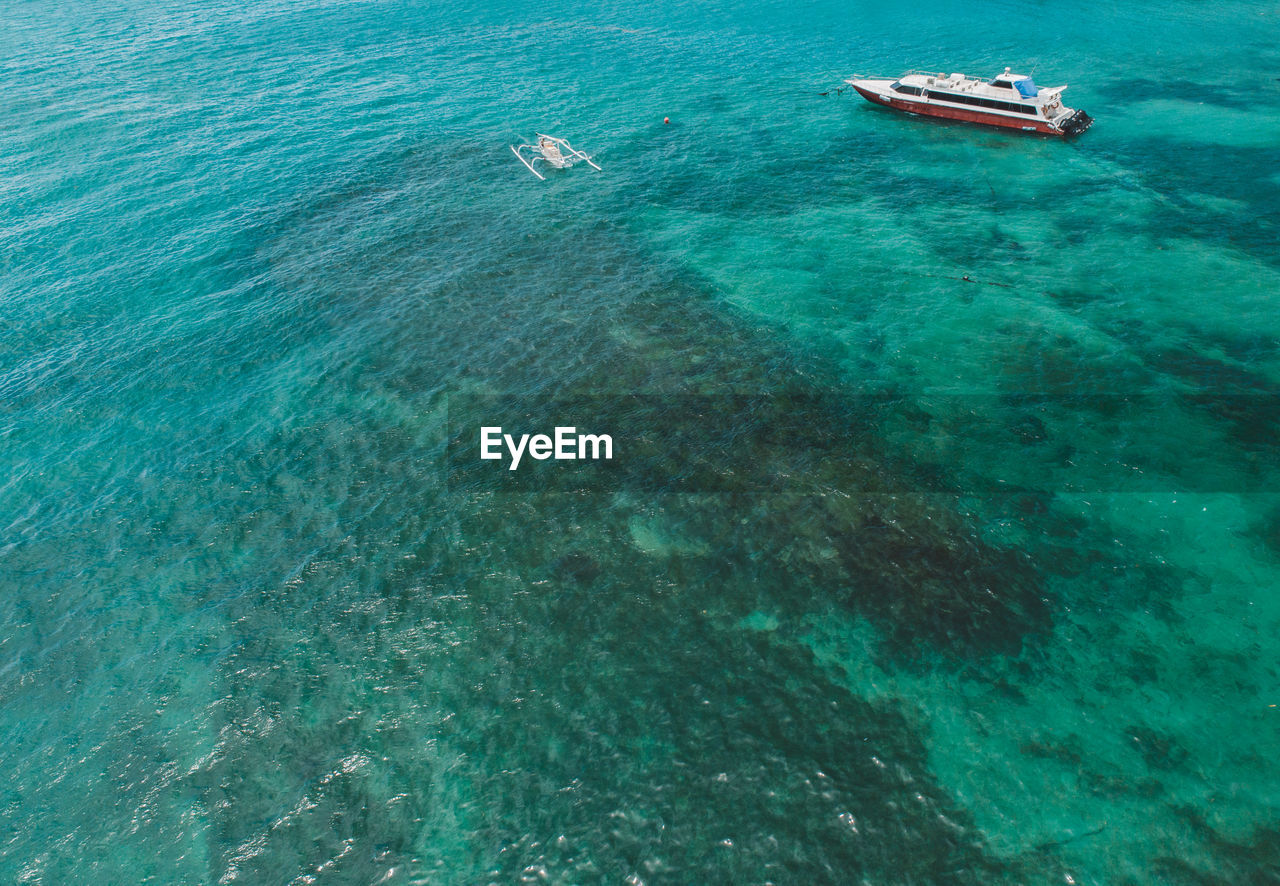 High angle view of sailboat in sea