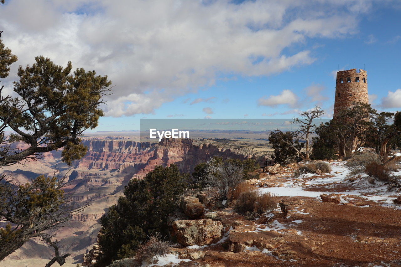 sky, cloud, rock, landscape, nature, environment, tree, scenics - nature, travel destinations, plant, travel, land, architecture, mountain, history, no people, wilderness, the past, beauty in nature, tourism, outdoors, rock formation, non-urban scene, ruins, day, built structure, desert, ancient, building, tranquility