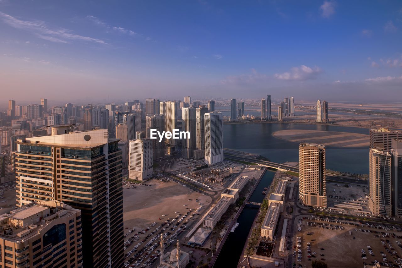 High angle view of buildings in city against sky