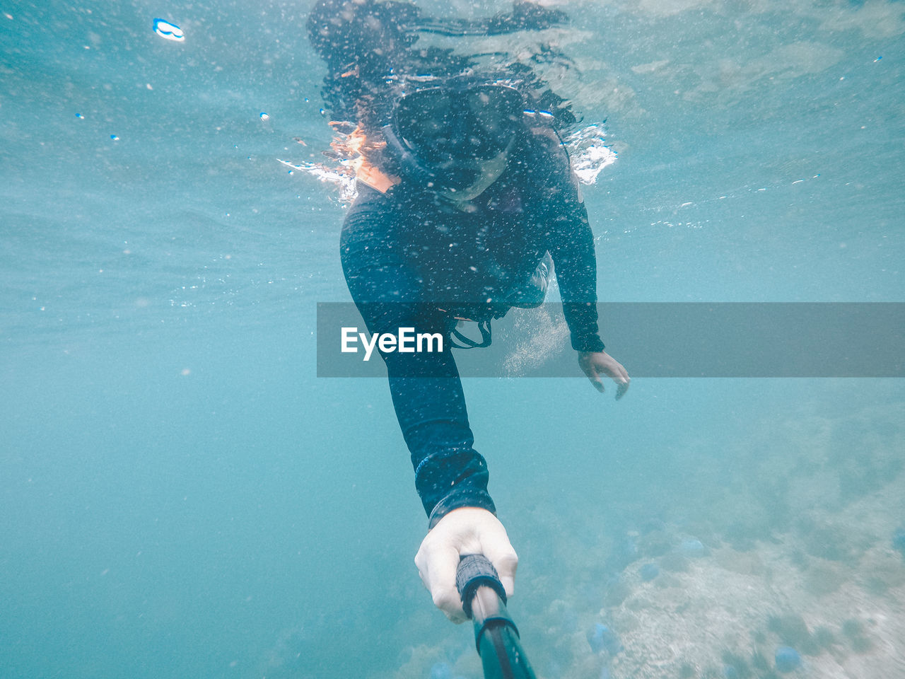 Woman swimming in undersea