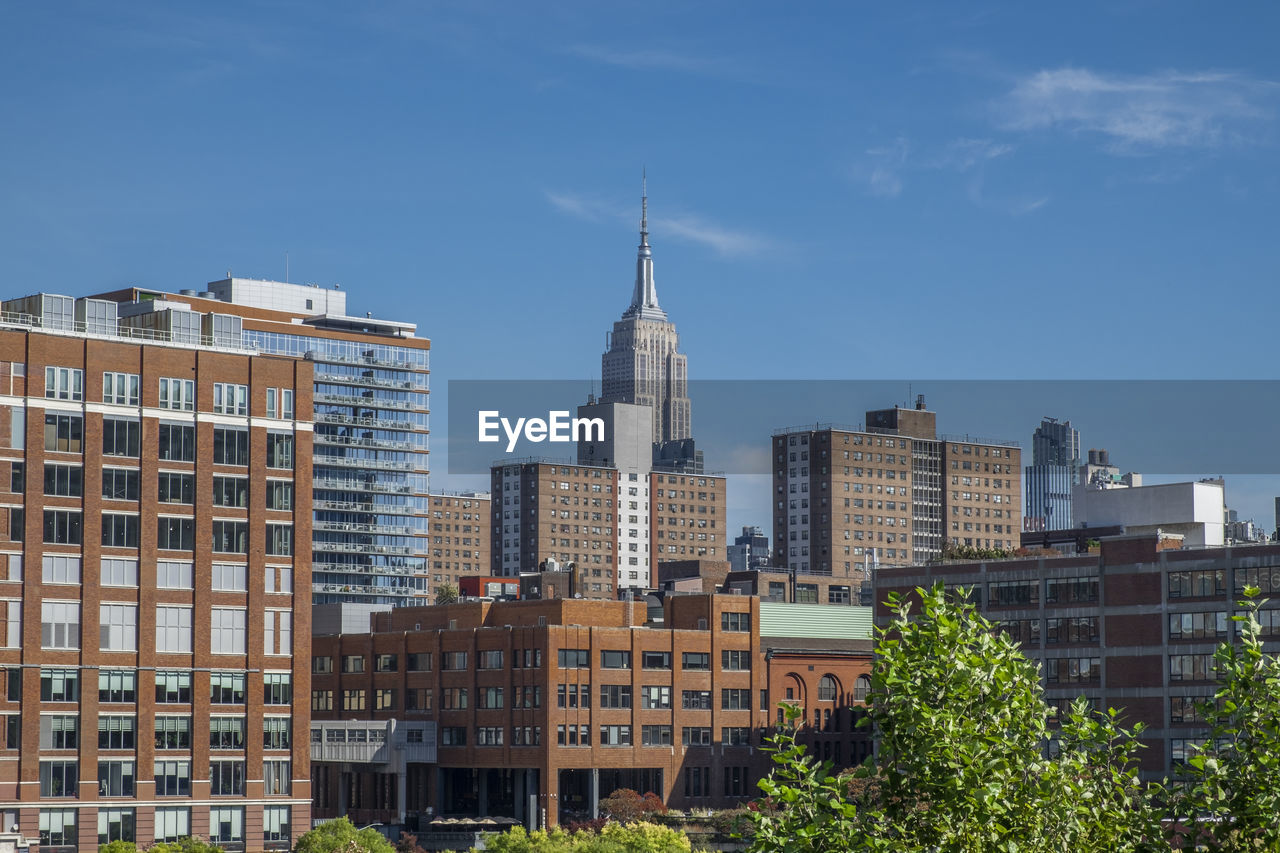 Buildings in city against sky