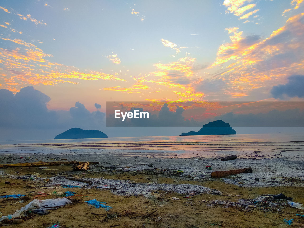 SCENIC VIEW OF SEA DURING SUNSET