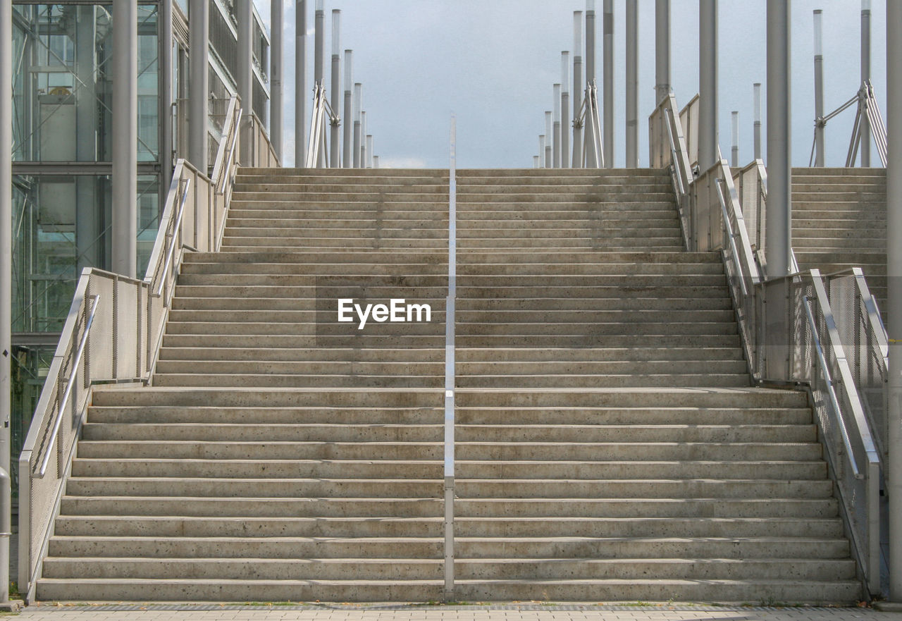 Low angle view of concrete staircase against sky