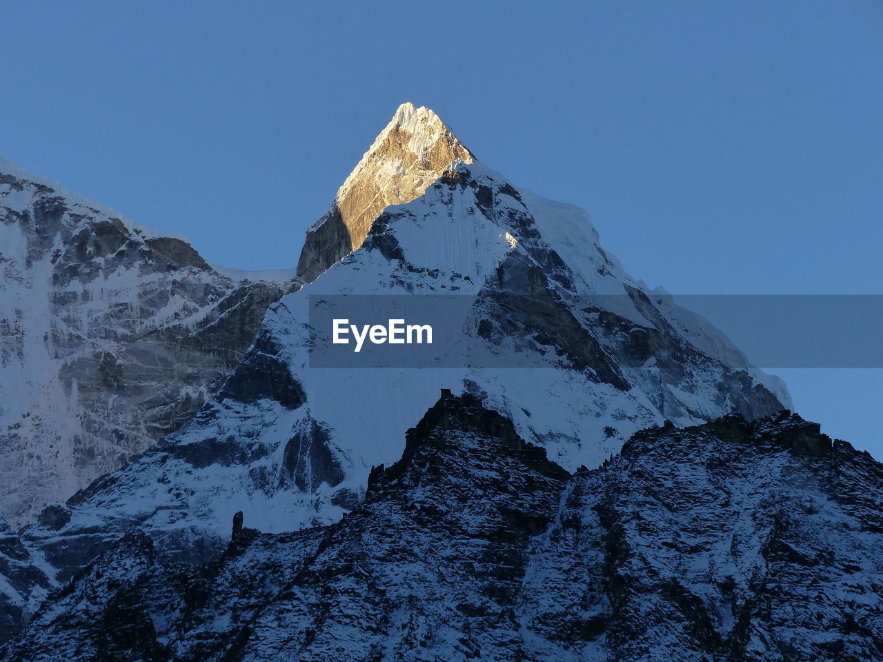 SNOWCAPPED MOUNTAIN AGAINST CLEAR BLUE SKY