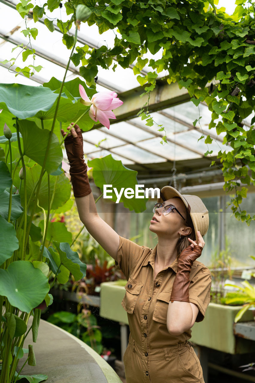 Young botanist working in botanical garden