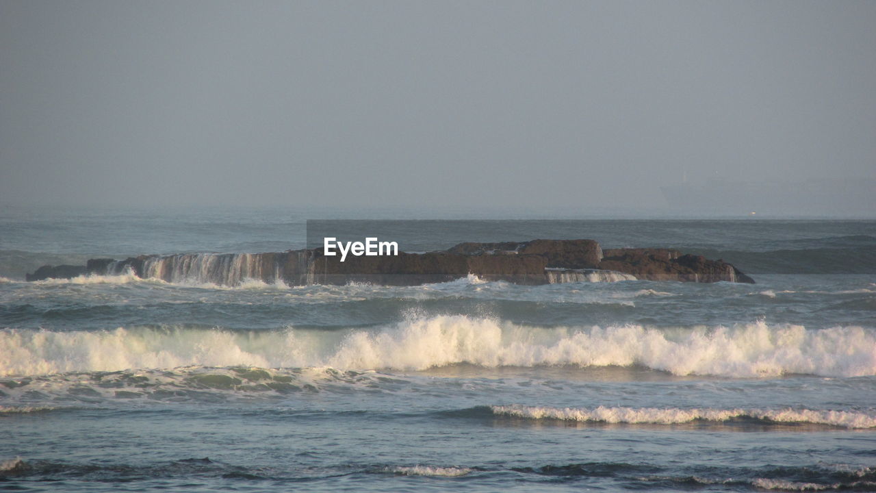 Scenic view of sea against clear sky