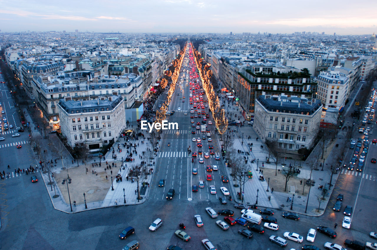 High angle view of busy street amidst buildings in city