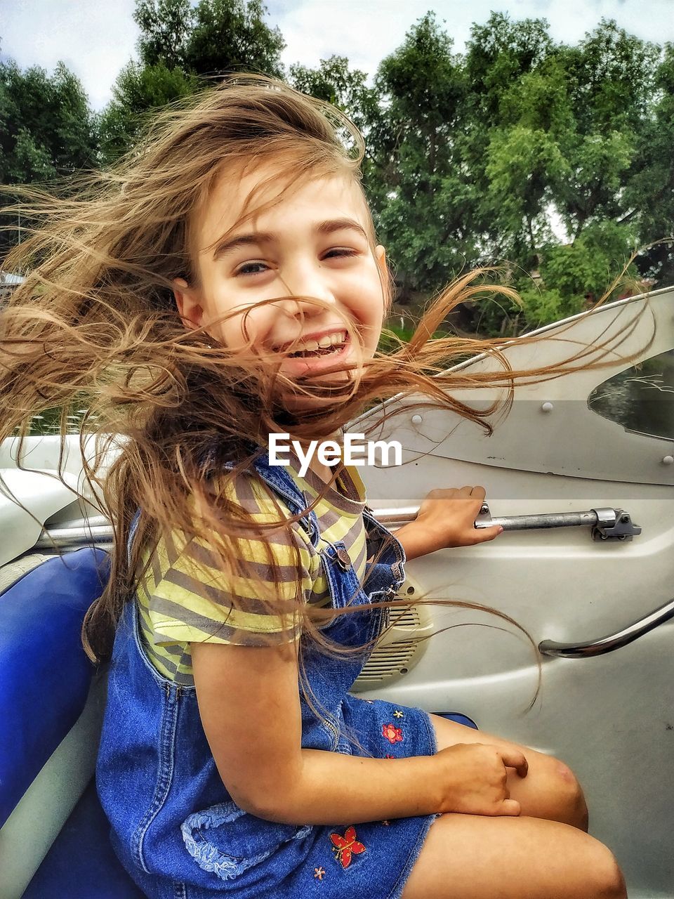 Portrait of smiling girl in car