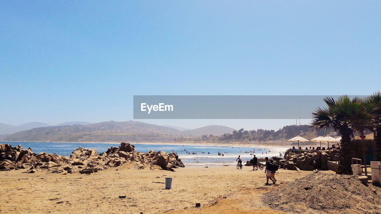 PANORAMIC VIEW OF BEACH AGAINST CLEAR SKY